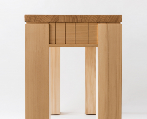 Light wood desk with linear decoration